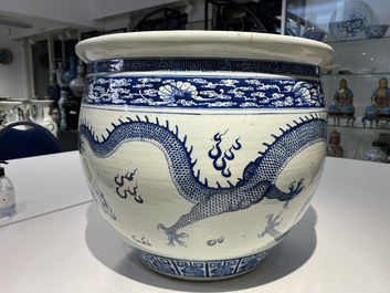 A Chinese blue and white 'dragons' fish bowl, Qianlong/Jiaqing